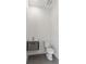 Modern powder room featuring sleek vanity, toilet, and neutral tile flooring creating a clean and stylish space at 14009 Daniels Ave, Port Charlotte, FL 33953
