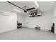 Bright two-car garage featuring painted floors, a sink, and ample storage space at 14009 Daniels Ave, Port Charlotte, FL 33953
