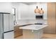 Beautiful kitchen with modern appliances, white countertops, island and pendant lighting at 14009 Daniels Ave, Port Charlotte, FL 33953