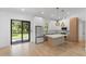 Modern kitchen with stainless steel refrigerator and sliding glass doors at 14009 Daniels Ave, Port Charlotte, FL 33953
