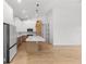 Well-lit kitchen with waterfall island and pendant lighting at 14009 Daniels Ave, Port Charlotte, FL 33953