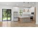 Modern kitchen with stainless steel appliances, quartz countertops, and island at 14009 Daniels Ave, Port Charlotte, FL 33953
