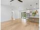 Open-concept living room flows into a modern kitchen with stainless steel appliances at 14009 Daniels Ave, Port Charlotte, FL 33953