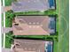 Aerial view showcasing the roof and landscaping of the home, with a pool and patio at 15037 Montello Way, Lakewood Ranch, FL 34211