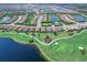 Overhead view of a neighborhood with golf course, water features, and luxurious landscaping at 15037 Montello Way, Lakewood Ranch, FL 34211