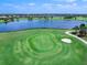 Scenic aerial of the golf course with beautiful lake view highlighting the lush green landscape and clear blue skies at 15037 Montello Way, Lakewood Ranch, FL 34211