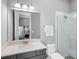 The bathroom features a walk-in shower with glass enclosure, a toilet and vanity at 15037 Montello Way, Lakewood Ranch, FL 34211