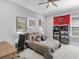 The bedroom comes with a ceiling fan, natural light and a fun and sporty theme at 15037 Montello Way, Lakewood Ranch, FL 34211