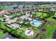 Aerial shot of the community pool, garden, and outdoor social spaces, showcasing the community lifestyle at 15037 Montello Way, Lakewood Ranch, FL 34211