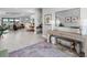 Bright entryway with luxury vinyl floors, stylish decor, and an open view to the living spaces at 15037 Montello Way, Lakewood Ranch, FL 34211