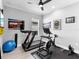 This exercise room is set up with fitness equipment and motivational decor at 15037 Montello Way, Lakewood Ranch, FL 34211
