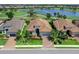 Beautiful home with meticulous landscaping, brick driveway, and an inviting front entrance at 15037 Montello Way, Lakewood Ranch, FL 34211