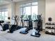 Well-equipped gym featuring several elliptical machines and a rack of kettlebells for a full-body workout at 15037 Montello Way, Lakewood Ranch, FL 34211