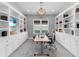 Well-appointed home office with custom built-ins and ample storage space at 15037 Montello Way, Lakewood Ranch, FL 34211