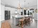 Open concept kitchen with stainless steel appliances, pendant lights and outdoor view at 15037 Montello Way, Lakewood Ranch, FL 34211