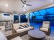Inviting lanai with a lounge area overlooking a pool and manicured landscape at 15037 Montello Way, Lakewood Ranch, FL 34211