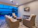 Cozy outdoor living area with comfortable seating and a view of the lake at 15037 Montello Way, Lakewood Ranch, FL 34211