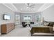 Spacious main bedroom boasts tray ceiling, two sitting chairs and great natural light at 15037 Montello Way, Lakewood Ranch, FL 34211