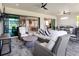 Beautifully furnished patio with modern outdoor kitchen and serene views, ideal for upscale relaxation at 15037 Montello Way, Lakewood Ranch, FL 34211