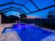 Private pool area with screened enclosure and view of the golf course at 15037 Montello Way, Lakewood Ranch, FL 34211