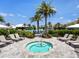 Relaxing hot tub surrounded by lounge chairs and lush greenery, perfect for unwinding at 15037 Montello Way, Lakewood Ranch, FL 34211