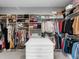 This walk-in closet has shelving, drawers, and hanging rods for maximum storage and organization at 15037 Montello Way, Lakewood Ranch, FL 34211