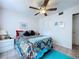 Bedroom with ample natural light, ceiling fan and closet at 1526 Mission Hills Blvd # 18B, Clearwater, FL 33759