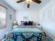 Cozy bedroom with tile floors, a ceiling fan and closet at 1526 Mission Hills Blvd # 18B, Clearwater, FL 33759