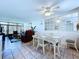 Bright dining area with wicker furniture and a view into the living area at 1526 Mission Hills Blvd # 18B, Clearwater, FL 33759