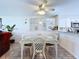 Cozy dining area with a wicker table and chairs set under a ceiling fan at 1526 Mission Hills Blvd # 18B, Clearwater, FL 33759