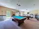 Game room features a billiard table, ping pong table, and exercise equipment at 1526 Mission Hills Blvd # 18B, Clearwater, FL 33759