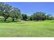 Manicured green space and mature trees add to the beauty of this property at 1526 Mission Hills Blvd # 18B, Clearwater, FL 33759