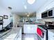 Open kitchen layout with stainless steel appliances and granite countertops at 1526 Mission Hills Blvd # 18B, Clearwater, FL 33759