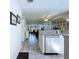 Open-concept floor plan showcasing a renovated kitchen with granite counters and stainless steel appliances, flowing into the living area at 1526 Mission Hills Blvd # 18B, Clearwater, FL 33759