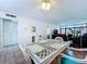 Open living area with tile flooring and a view to the sliding glass doors at 1526 Mission Hills Blvd # 18B, Clearwater, FL 33759