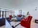 Spacious living room with a plush area rug, comfortable seating, and natural light at 1526 Mission Hills Blvd # 18B, Clearwater, FL 33759