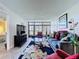 Bright living room featuring a large window, comfortable seating, and stylish floral rug over neutral tile flooring at 1526 Mission Hills Blvd # 18B, Clearwater, FL 33759