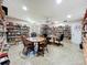 Large reading room is lined with books, tables and chairs for comfortable reading at 1526 Mission Hills Blvd # 18B, Clearwater, FL 33759
