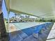 Community shuffleboard courts under a covered area with seating for spectators at 1526 Mission Hills Blvd # 18B, Clearwater, FL 33759