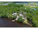 Gorgeous aerial view of a home and lake access featuring kayak storage and private dock at 15518 29Th E St, Parrish, FL 34219