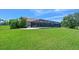Expansive backyard with lush green grass and a screened-in patio, perfect for outdoor living at 15518 29Th E St, Parrish, FL 34219