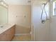 Simple bathroom with a single vanity, a shower, and neutral finishes at 15518 29Th E St, Parrish, FL 34219