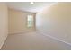 A spacious bedroom with neutral carpet, large window and plenty of natural light at 15518 29Th E St, Parrish, FL 34219