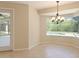 Empty dining area with tile flooring and natural light, providing a clean space for your design dreams at 15518 29Th E St, Parrish, FL 34219