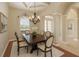 Elegant dining room featuring a chandelier and stylish decor, ideal for Gathering meals and entertaining at 15518 29Th E St, Parrish, FL 34219