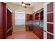 Well-appointed home office with custom built-in cabinetry and granite countertops at 15518 29Th E St, Parrish, FL 34219