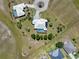 Aerial perspective of two homes each with pools, surrounded by green lawns in a residential neighborhood at 17343 Cayo Ln, Punta Gorda, FL 33955