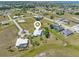 Wide aerial view of a residential area, showcasing home layout, landscaping, and neighborhood connectivity at 17343 Cayo Ln, Punta Gorda, FL 33955