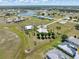 Panoramic aerial view of homes in a beautiful residential community with a lake in the distance at 17343 Cayo Ln, Punta Gorda, FL 33955