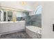 Luxurious bathroom features dual sinks, a soaking tub, and exquisite tile work at 17343 Cayo Ln, Punta Gorda, FL 33955